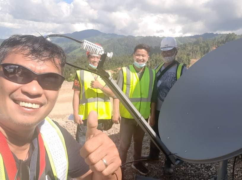 VSAT installers with a dish