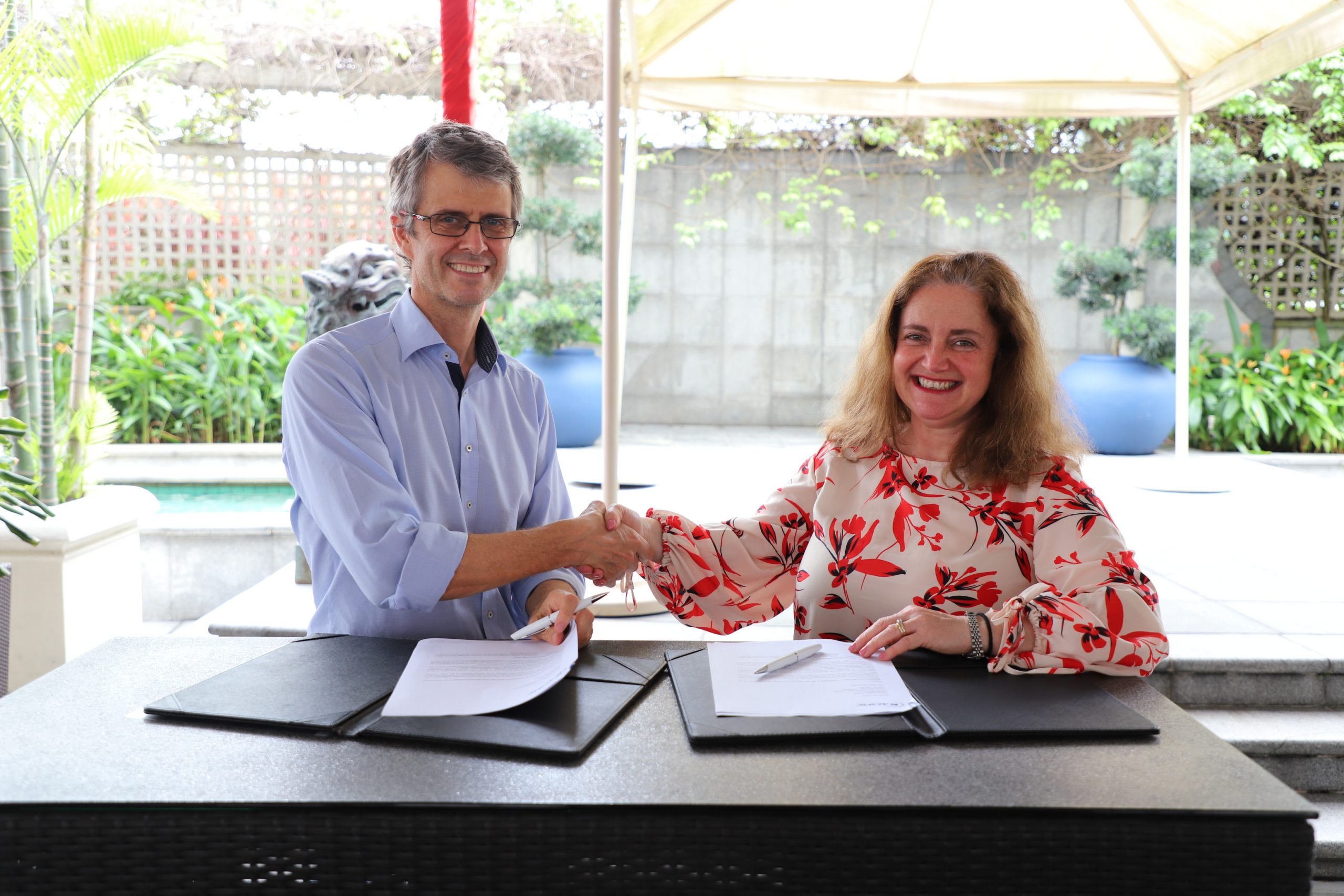 Christian signing the release with Betty