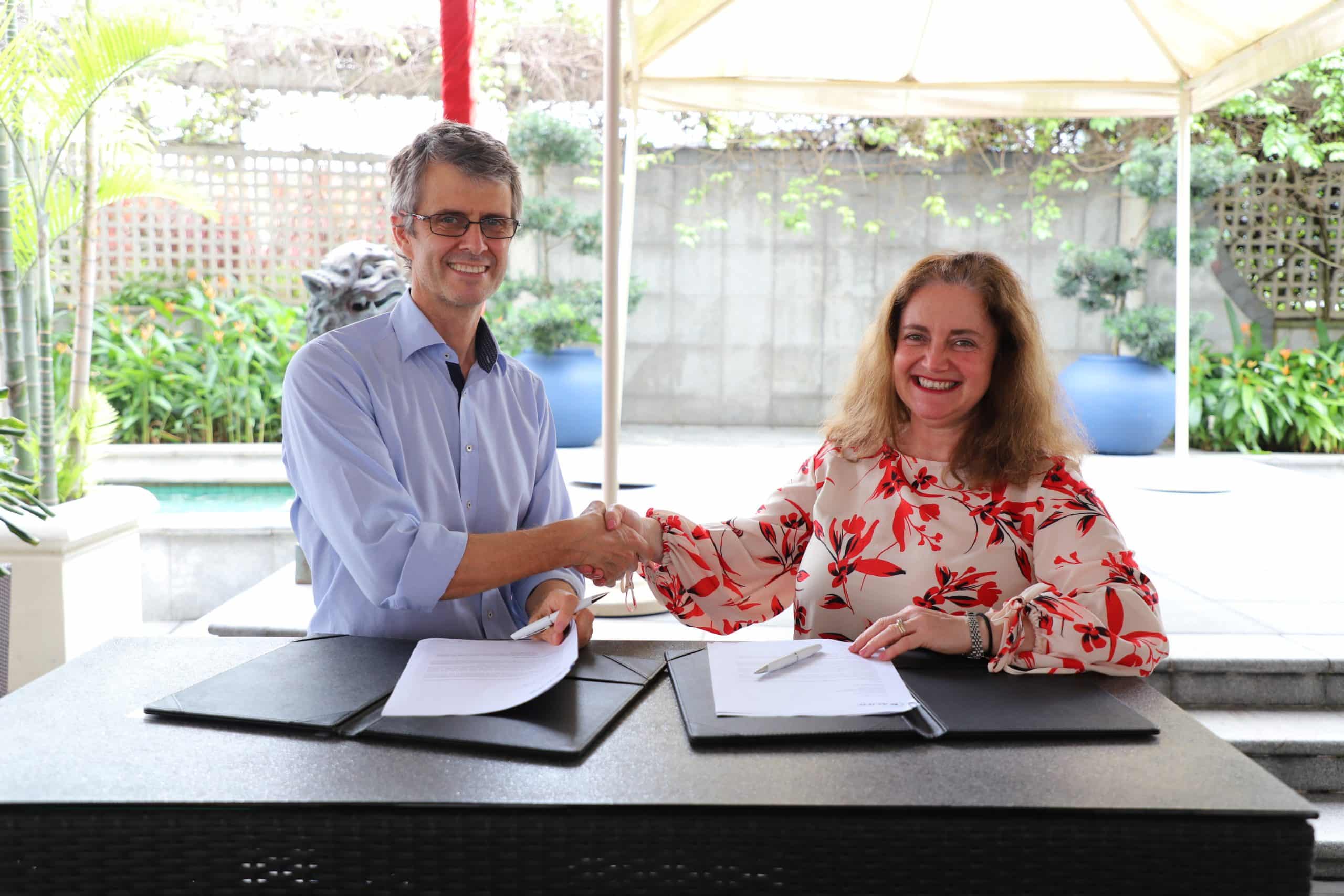 Christian signing the release with Betty